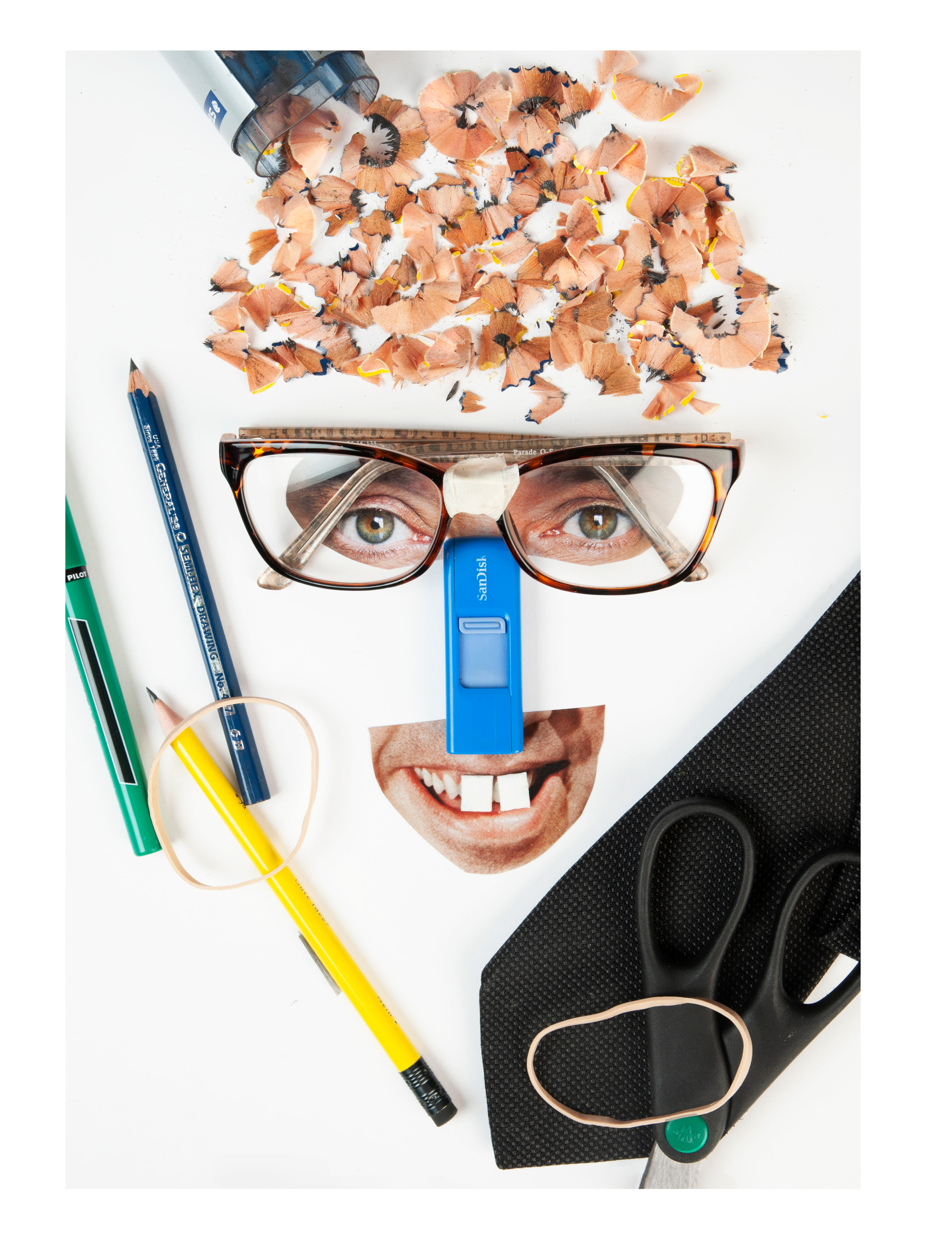 Human Stereotype of The Nerd with pencil sharpenings for the hair, flash drive for the nose and gum for the buckteeth