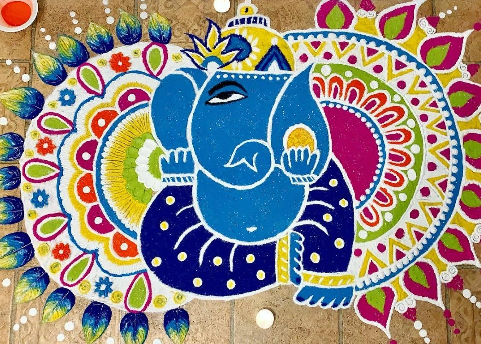 A peacock Rangoli which is an indian art form created by Isha Mehta